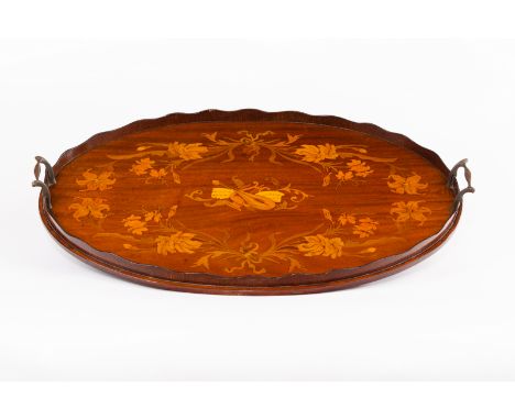 An Edwardian mahogany oval tray, inlaid a central vignette of a lute and music within a surround of flowers, ribbon ties, etc