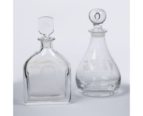 An Orrefors glass decanter with sloping shoulder engraved to one side with a double portrait medallion and a carafe engraved 