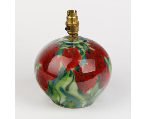 Dartington Pottery, a globular lamp base, design of red roses, 16cm high
