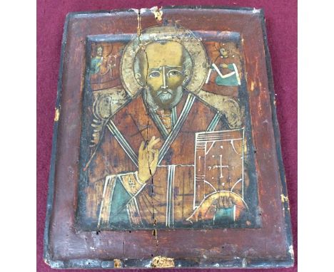 19th Century Russian School/Portrait of St Nicholas/with attendant saints in the top corners/icon painted on wood, 31cm x 24.