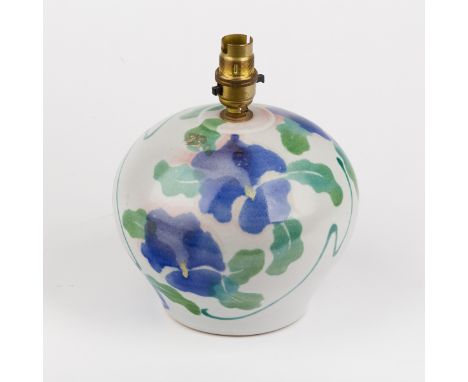 Dartington Pottery, a globular lamp base, design of blue clematis flowers, 16cm high