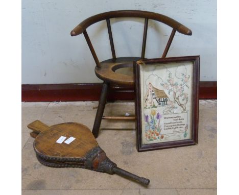 A child's commode chair, a pair of wooden bellows and a needlework picture 