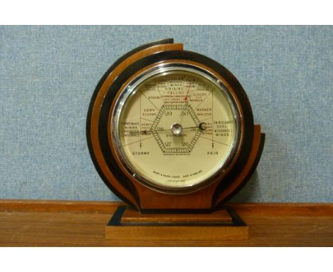 An Art Deco beech aneroid barometer 