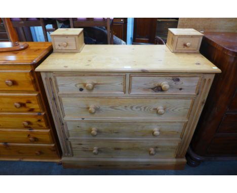 A pine chest of drawers 