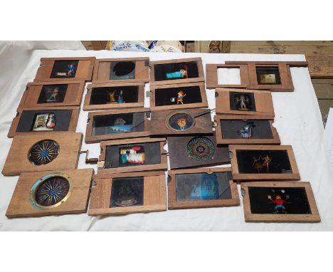 A box containing a quantity of late 19th/early 20th Century mechanical magic lantern slides including crank handled kaleidosc