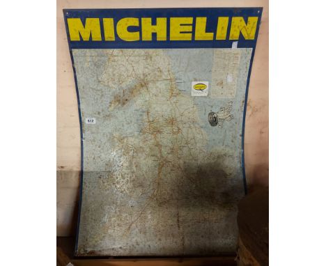 A large vintage metal 'Michelin Road Map' sign