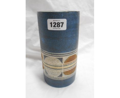 A 1970's Troika Pottery Cornwall cylinder vase with hand painted frieze roundel decoration on a textured blue ground - painte
