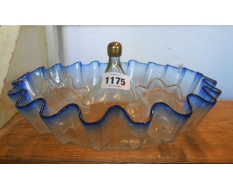 A glass epergne base with blue frilled rim and two related flutes