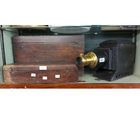 An antique magic lantern in wooden box - sold with a quantity of slides including Louis Wain examples, etc.