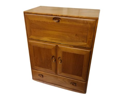 An 82cm vintage Ercol Windsor light elm bureau / drinks cabinet with fitted interior, double cupboard and long drawer under, 