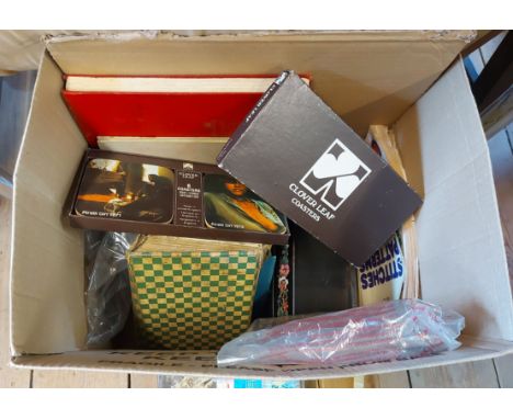 A box containing a quantity of books and other items including Noddy, Punch &amp; Judy, a set of Pirelli girl coasters, etc.