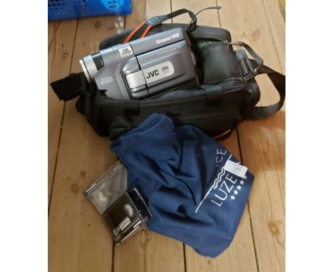 A cased JVC GR-FXM75 compact VHS camcorder and bag of tapes
