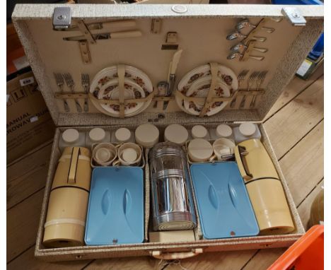 A large vintage cased Brexton picnic set, with ceramic and plastic contents - one saucer a/f