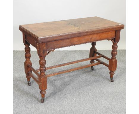 A Victorian oak card table, on turned legs, 92cm