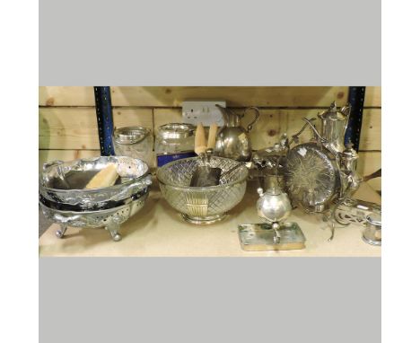 A shelf of silver plated items, to include bowls and teasets