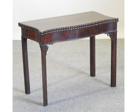 A George III mahogany serpentine card table, 86cm