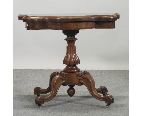 A Victorian walnut fold over card table, 89cm