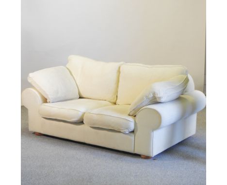 A modern cream upholstered two seater sofa, 185cm