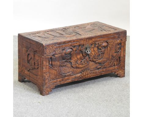 An early 20th century eastern carved camphor wood trunk, 83cm