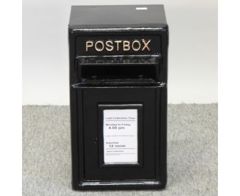 A reproduction black painted metal post box, 24cm