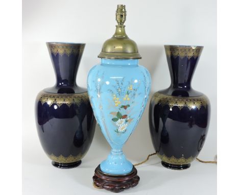 A pair of blue glazed Sarreguemines vases, 44cm high, together with a painted glass table lamp