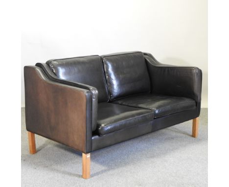 A 1960's Danish Mogensen style black leather upholstered sofa, 153cm