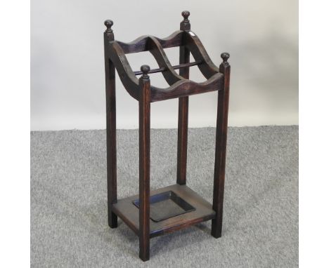 A 1920's oak stick stand, 31cm