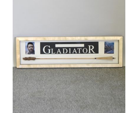 A flaming arrow prop from Gladiator (2000) movie, housed in a glazed display case, 32 x 110cm, with a certificate of authenti