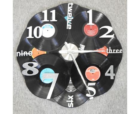 A vintage style wall clock, decorated with vinyl records, 73cm