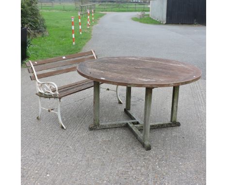 A garden bench, 125cm, together with a teak circular garden table, 130cm diameter 