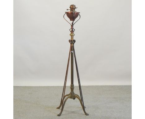 An Arts and Crafts copper and brass adjustable standard oil lamp, in the manner of W.A.S. Benson, inscribed Benson to the spi