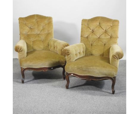 A pair of mid 20th century gold upholstered button back armchairs