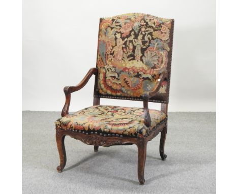 A 17th century style tapestry upholstered armchair, on cabriole legs