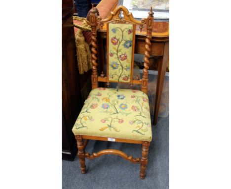 A PAIR OF 19TH CENTURY SATINWOOD SIDE CHAIRS with carved finials, barley twist supports, tapestry upholstered backs and seats