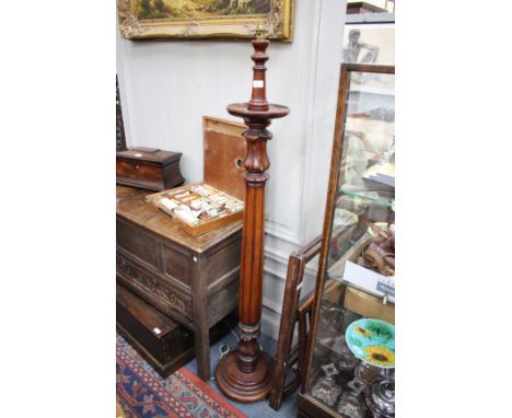 A MAHOGANY LAMP STANDARD with reeded column and turned spreading base, 163cm high