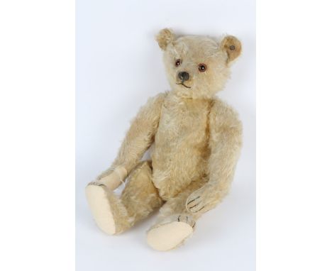 A 1920'S STEIFF BLOND TEDDY BEAR, button to ear, 48cm in length