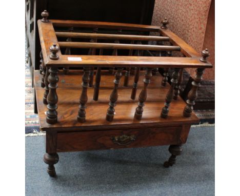 A VICTORIAN WALNUT THREE DIVISIONAL CANTERBURY the top with turned supports over single frieze drawer and standing on turned 