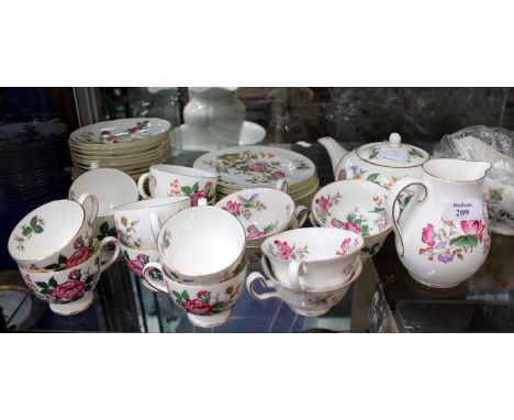 A WEDGEWOOD CHARNWOOD PATTERED DINNER AND TEA SERVICE with dinner plates, tea plates, teapot, gravy boat and stand, milk jug,