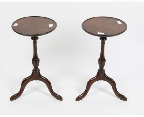 AN OAK DRESSING TABLE STOOL with shaped cane seat and standing on turned legs united by stretchers with carved feet, 60cm wid