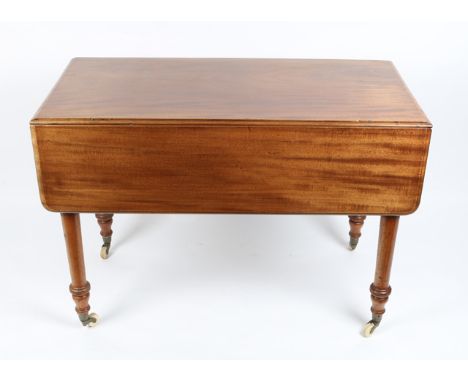 A VICTORIAN MAHOGANY PEMBROKE TABLE with turned tapering legs terminating in brass and ceramic casters, 106cm wide