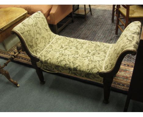 AN EARLY 20TH CENTURY OAK FRAMED WINDOW SEAT with tapestry upholstery and scrolling ends with fluted legs 113cm wide 