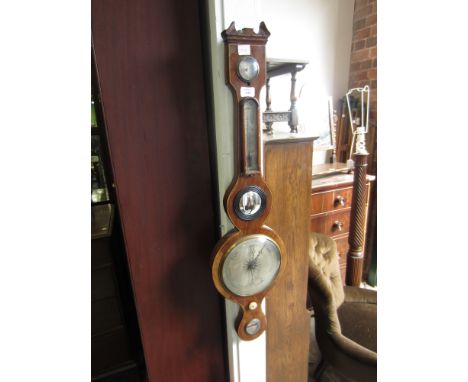 A MAHOGANY WHEEL BAROMETER with hydrometer, thermometer, convex mirror and level, signed 'D Maffia of Monmouth', 95cm high