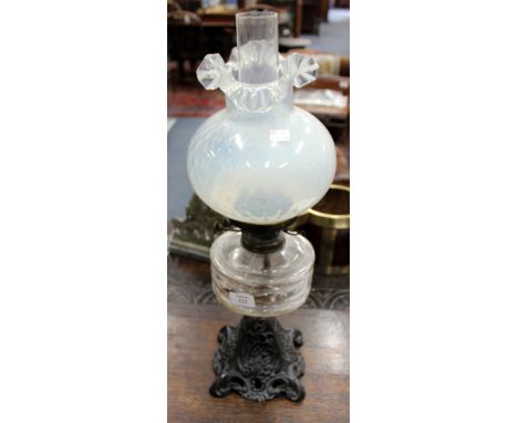A VICTORIAN CAST IRON YOUNGS SPECIAL OIL LAMP with opaline glass shade, 60cm tall 