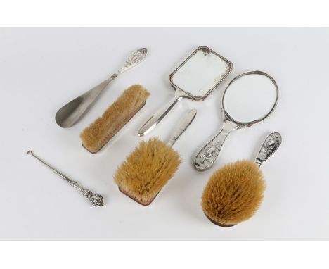 A THREE PIECE SILVER BACKED DRESSING TABLE SET with engine turned decoration, marks for Birmingham, a further three piece dre