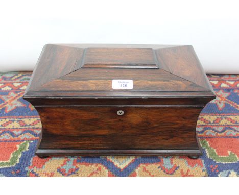 A 19TH CENTURY ROSEWOOD TEA CADDY with sarcophagus form, mother of pearl escutcheon and standing on short turned feet, lid li