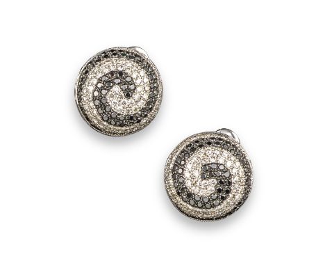 A pair of black and white diamond swirl earrings, of bombe design set in white gold, folding post and clip fittings, 16cm wid