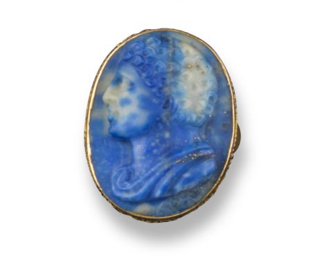 A late 18th / early 19th century lapis lazuli cameo depicting the draped bust of a curly-haired youth, in a gold ring, 2.5cm 