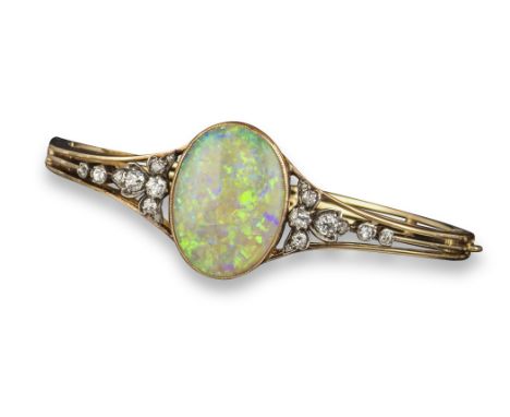 A Victorian opal and diamond bangle, the oval-shaped opal set within foliate surround of cushion-shaped diamonds in silver on