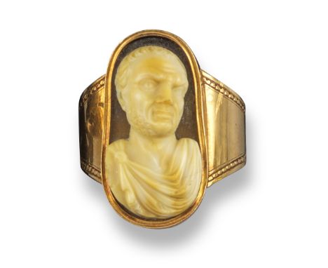 A late 18th / early 19th century sardonyx cameo depicting the frontal bust of a Roman with cloak, 2.5cm high, in a 19th centu