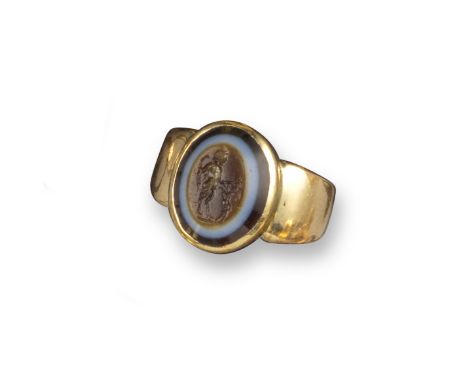 A Roman carved three-colour intaglio depicting a standing and aroused Pan, c1st century AD, Pan holding a shepherd's club and